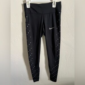 Women’s Nike Dri-Fit leggings with silver and black dots, size XS